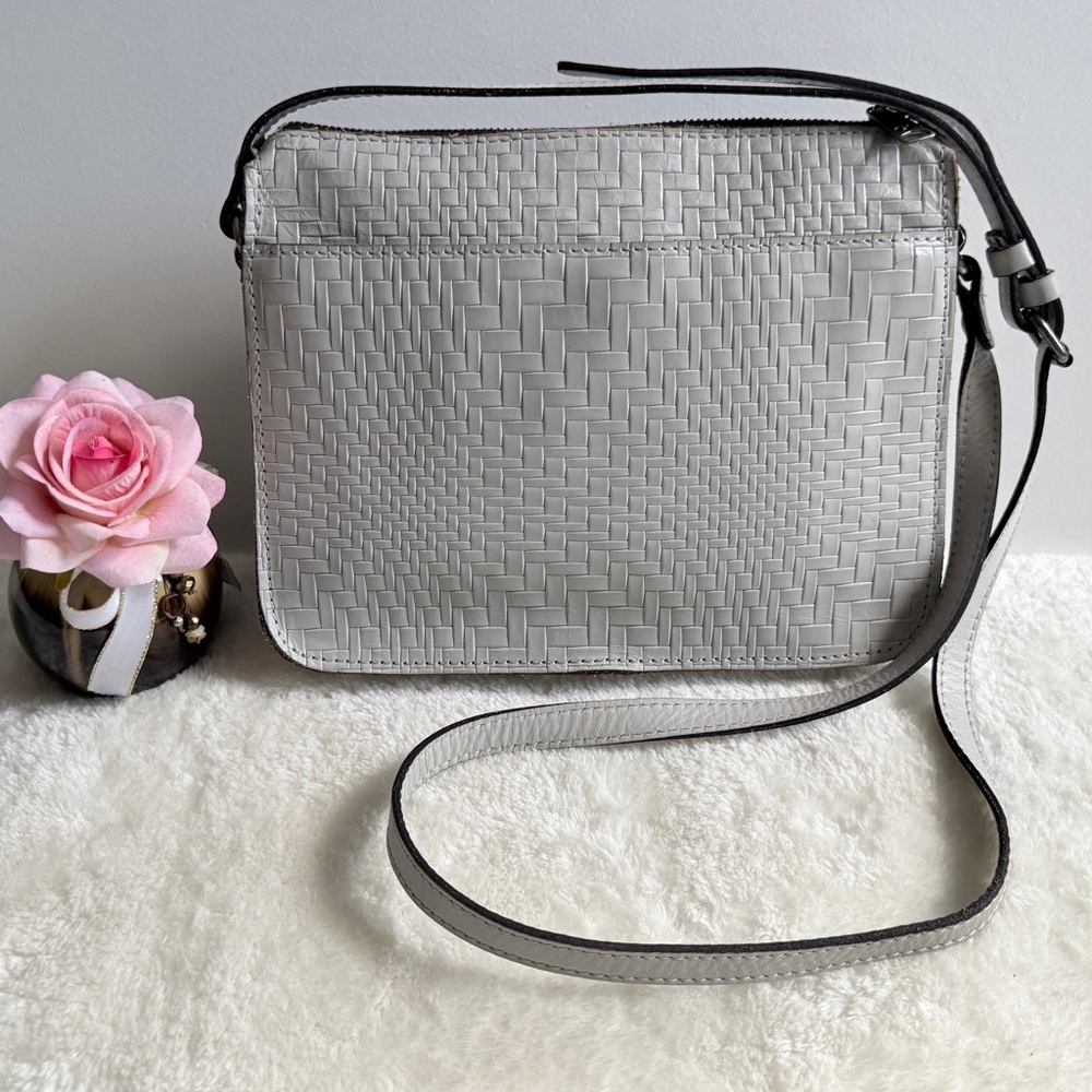 Patricia Nash Nazaire crossbody bag featuring a light gray woven leather design